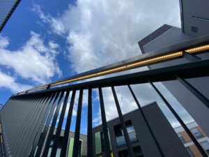 PaKK Backnang residential complex: LAMANO U60x40 LED stainless steel handrail and the bespoke LED lighting solution in the support post